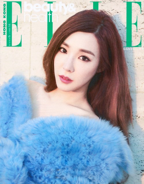 Tiffany poses for ELLE Magazine in a bright blue fur coat. 