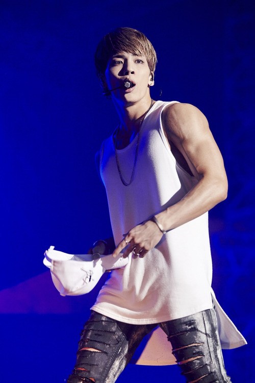 Jonghyun flaunts his muscular arms in this fitting white tank. / Source: Naver