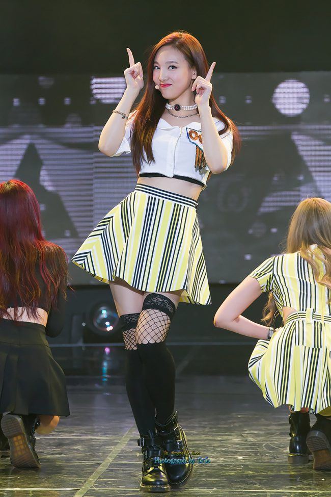 The fishnet and yellow skirts paired well