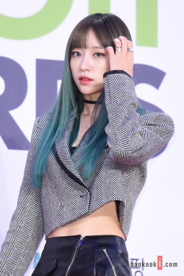 Hani spices up her smart casual cropped suit with a choker. 