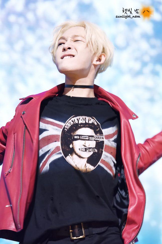 Former WINNER member Taehyun looks punk rock in a choker and red leather jacket. 