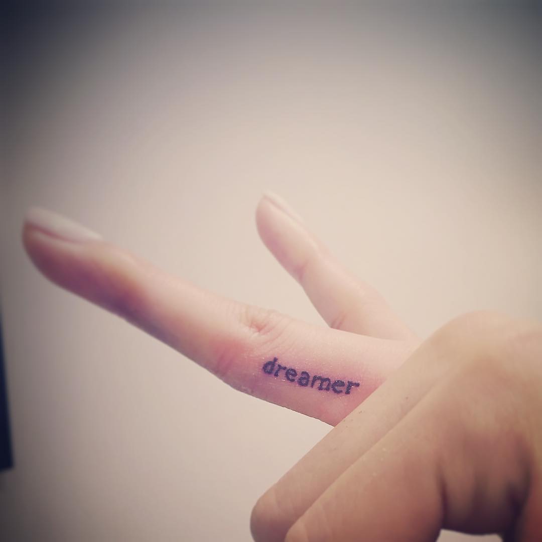2. "Dreamer" Finger Tattoo. 